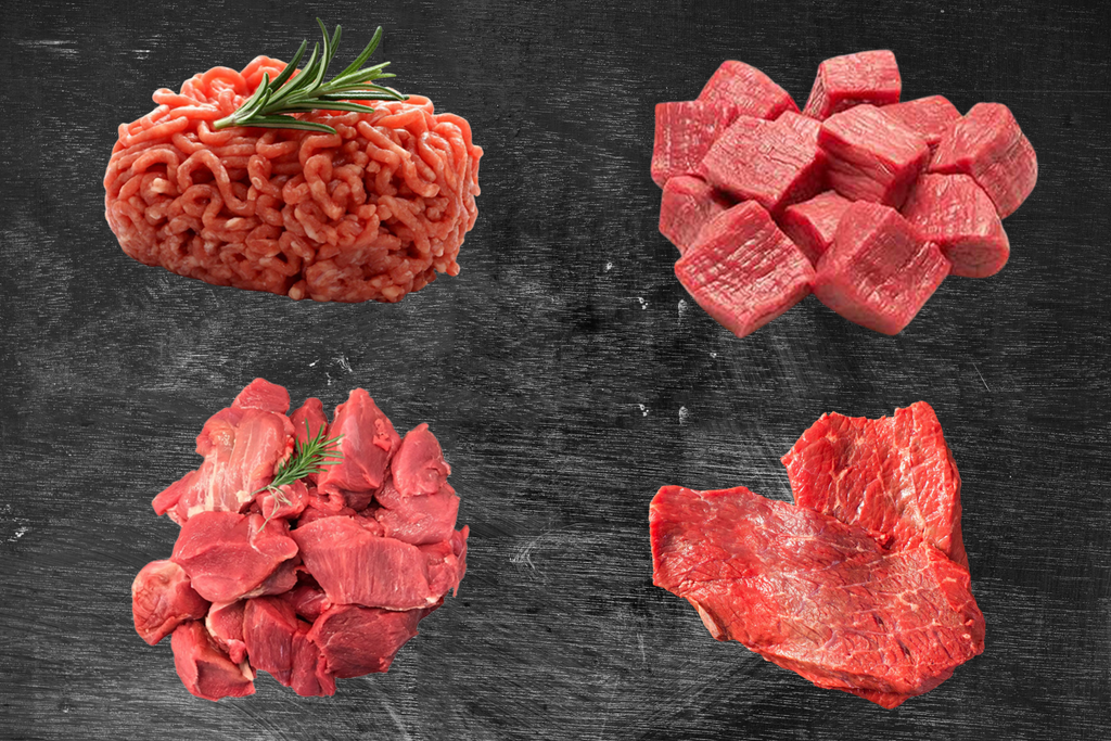 Four different cuts of raw meat on a dark surface